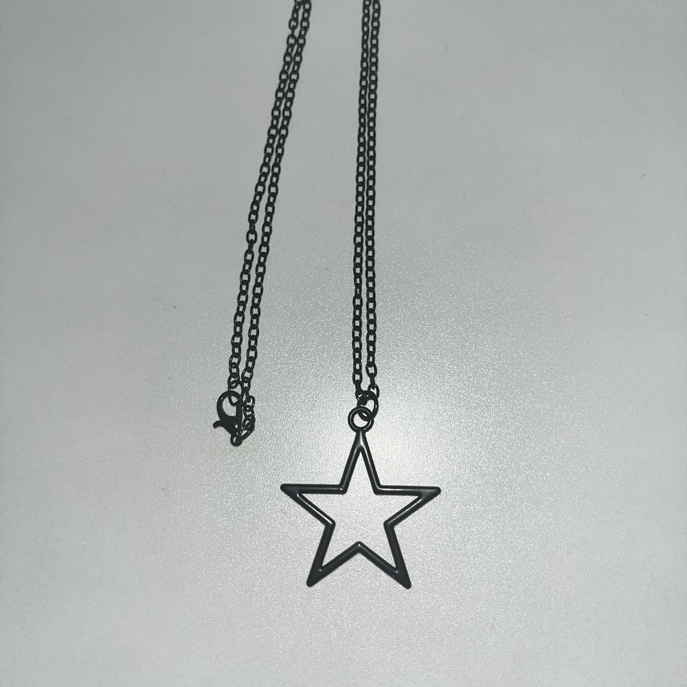 Large size, black, star necklace.